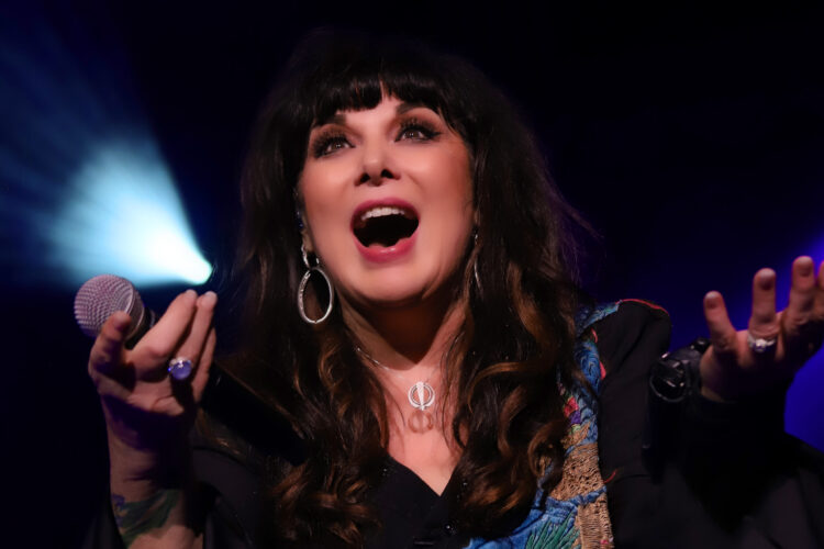 Ann Wilson Singing, Holding A Microphone