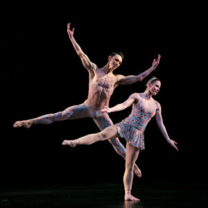Two dancers from the Paul Taylor Dance Company dancing on stage