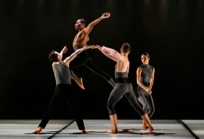 Four Dancers From The Paul Taylor Dance Company Shown Mid-dance On Stage
