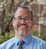 Headshot of a man smiling